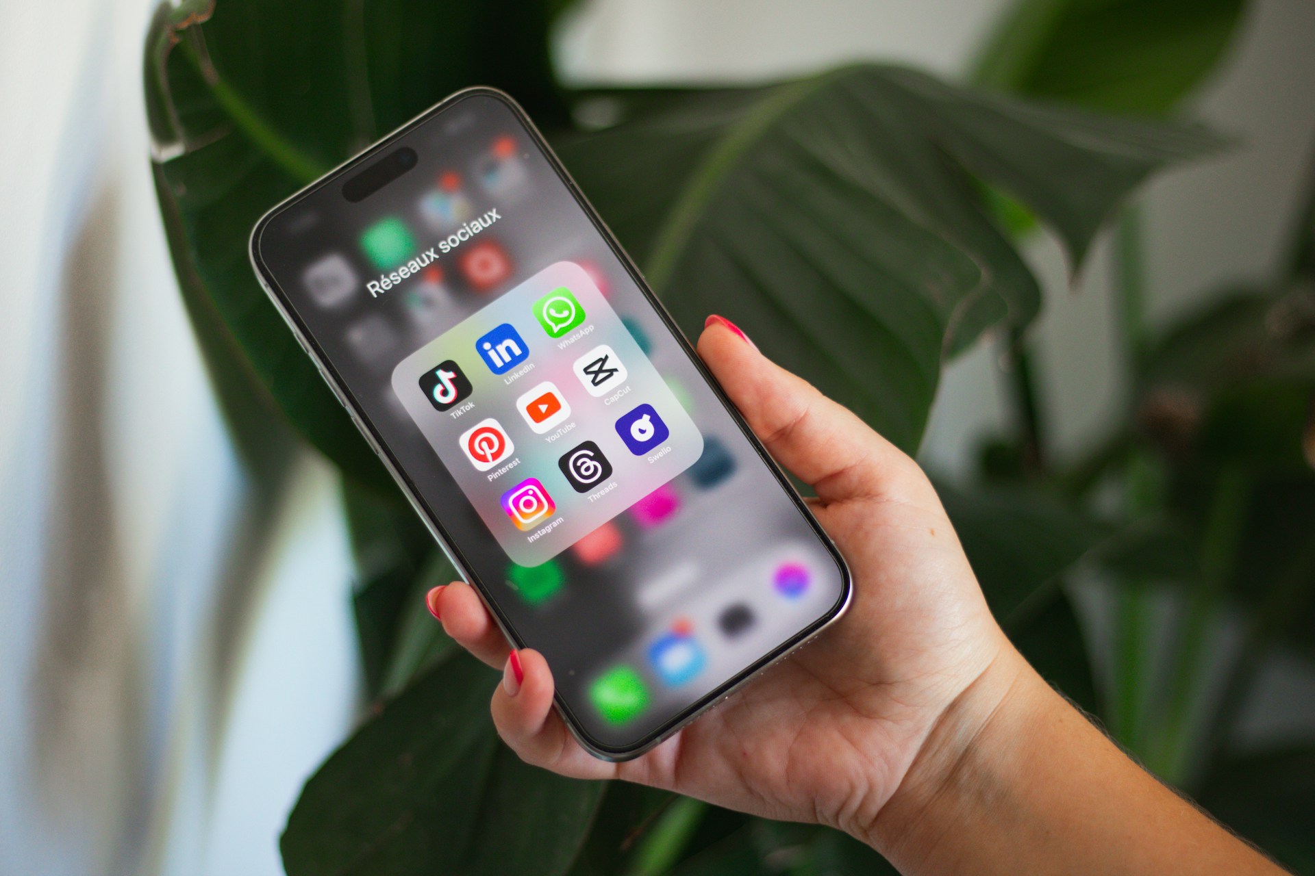 Person using mobile phone for social media